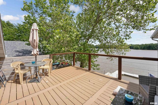 905 1st St, Camanche, IA 52730 - deck featuring a water view and outdoor dining area