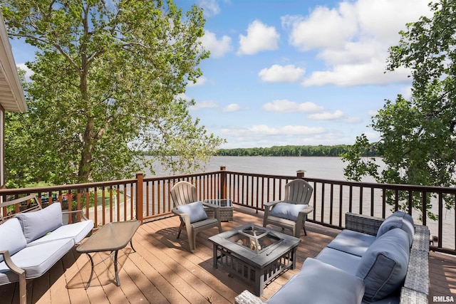 905 1st St, Camanche, IA 52730 - wooden terrace with an outdoor living space with a fire pit and a water view
