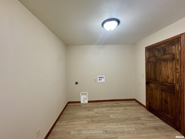 1492 45th St, New Boston, IL 61272 - washroom with electric dryer hookup, light wood-style flooring, hookup for a washing machine, a textured ceiling, and baseboards