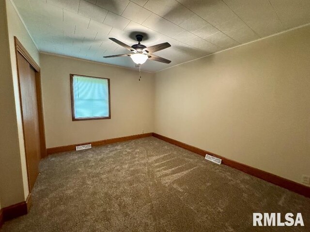 1492 45th St, New Boston, IL 61272 - unfurnished bedroom featuring carpet floors, baseboards, a closet, and ceiling fan