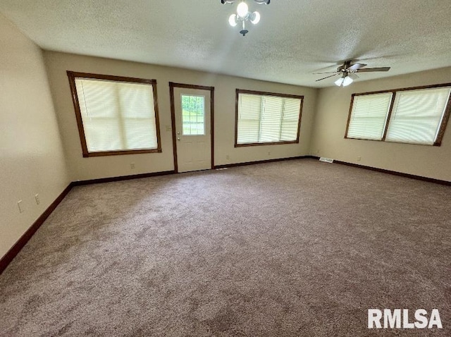 1492 45th St, New Boston, IL 61272 - carpeted spare room featuring a textured ceiling, baseboards, and ceiling fan