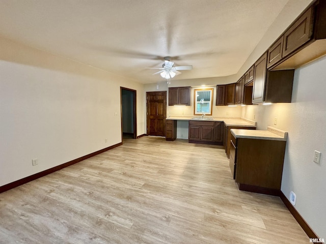 1492 45th St, New Boston, IL 61272 - kitchen with a ceiling fan, light wood-style floors, dark brown cabinetry, and baseboards