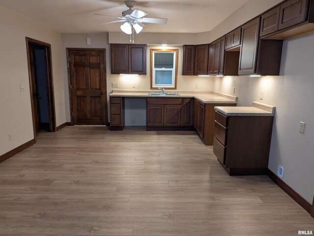 1492 45th St, New Boston, IL 61272 - kitchen featuring a sink, ceiling fan, baseboards, and dark brown cabinets