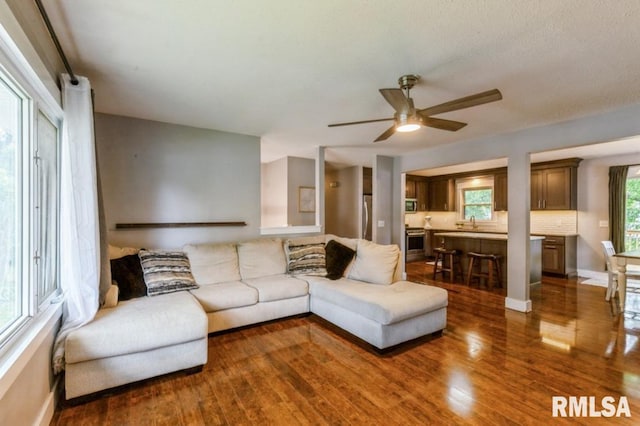 3071 S Hampton Dr, Bettendorf, IA 52722 - living area featuring ceiling fan and wood finished floors