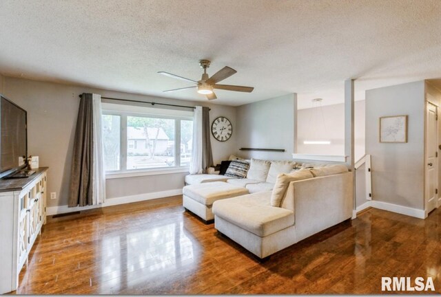 3071 S Hampton Dr, Bettendorf, IA 52722 - living area featuring wood finished floors, a textured ceiling, and ceiling fan