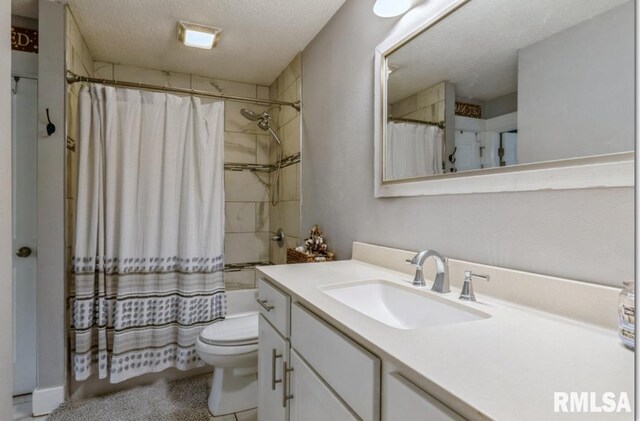 3071 S Hampton Dr, Bettendorf, IA 52722 - bathroom with vanity and a textured ceiling