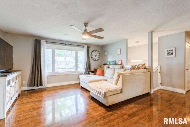 3071 S Hampton Dr, Bettendorf, IA 52722 - living area featuring a textured ceiling, ceiling fan, and wood finished floors