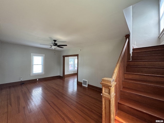 1122 E Colorado St, Davenport, IA 52803 - stairway with ceiling fan, wood finished floors, and baseboards