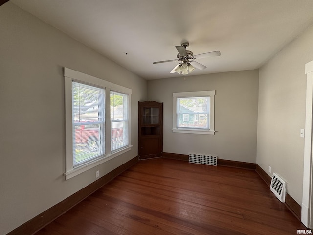 1122 E Colorado St, Davenport, IA 52803 - unfurnished room featuring hardwood / wood-style floors, ceiling fan, and baseboards