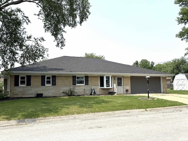 1110 7th St, Durant, IA 52747 - single story home featuring a garage, concrete driveway, a front lawn, and brick siding