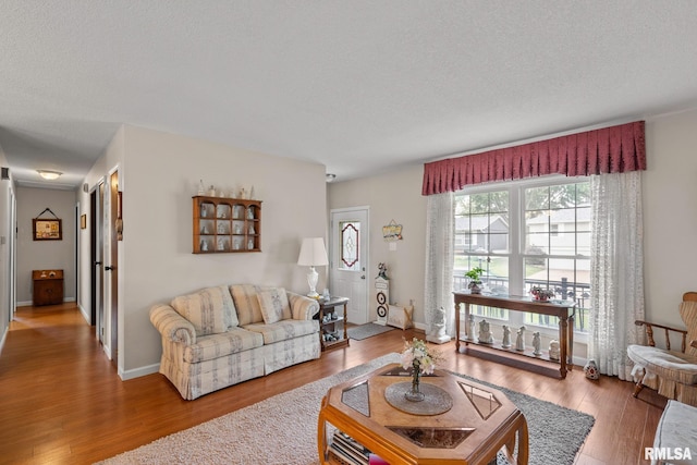 1415 W 59th St, Davenport, IA 52806 - living area featuring wood finished floors and a textured ceiling