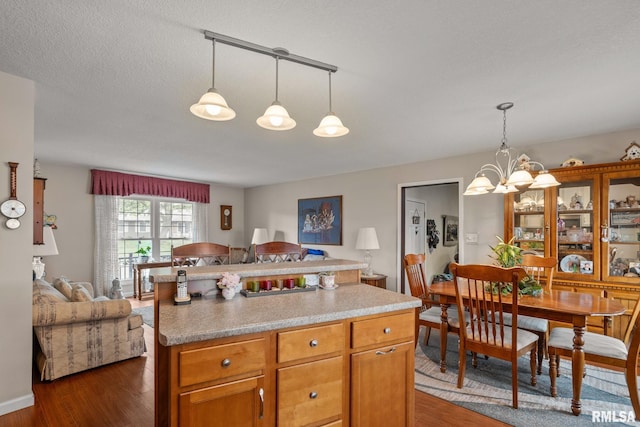 1415 W 59th St, Davenport, IA 52806 - kitchen with open floor plan, dark wood-style floors, and a chandelier