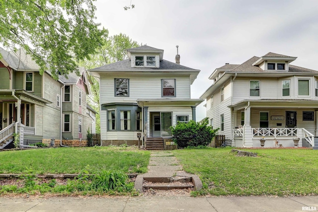 627 5th Ave S, Clinton, IA 52732 - traditional style home featuring covered porch and a front lawn