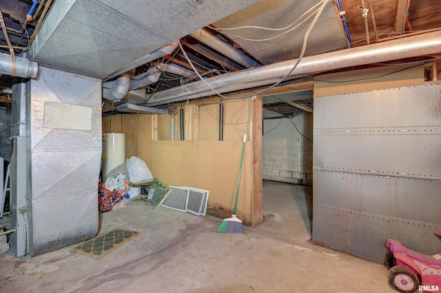 627 5th Ave S, Clinton, IA 52732 - unfinished basement featuring water heater and heating unit