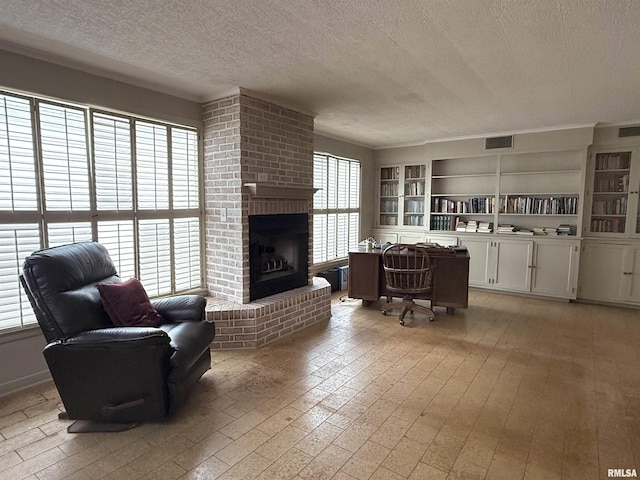 215 3rd St, Carmi, IL 62821 - living room with a textured ceiling, a fireplace, and built in features
