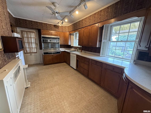215 3rd St, Carmi, IL 62821 - kitchen with dishwasher, oven, wallpapered walls, rail lighting, and a sink