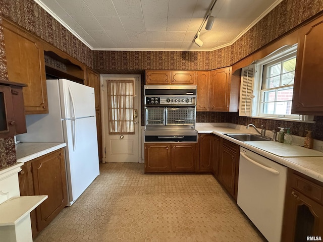 215 3rd St, Carmi, IL 62821 - kitchen with a sink, white appliances, rail lighting, a warming drawer, and light countertops