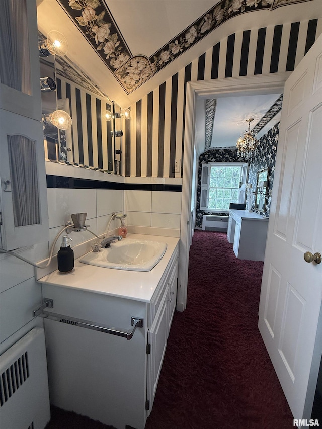 215 3rd St, Carmi, IL 62821 - bathroom with wallpapered walls, radiator, a chandelier, vanity, and wainscoting