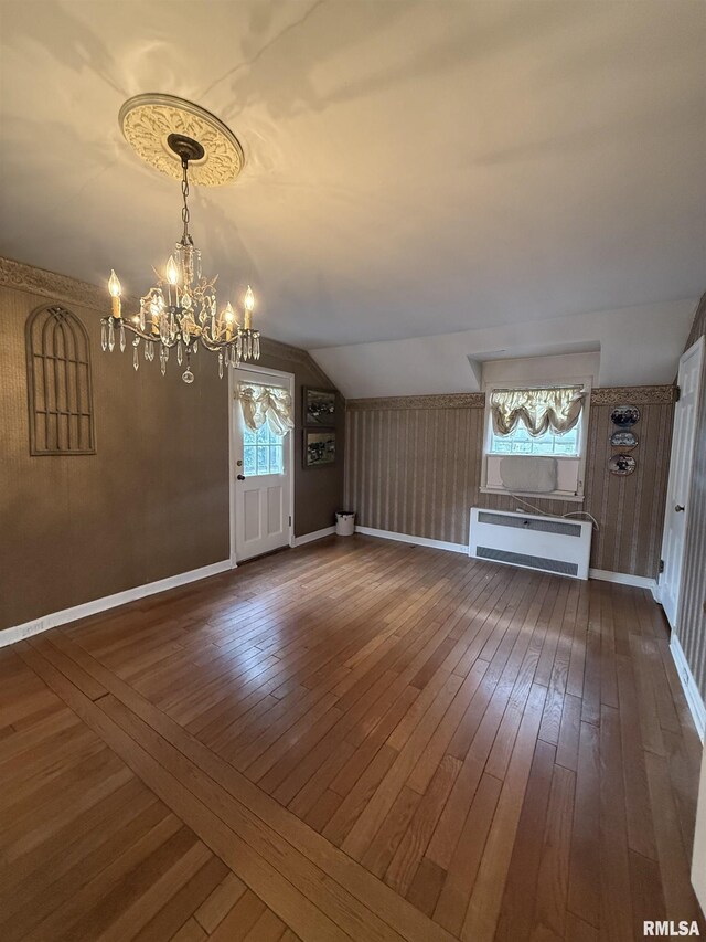 215 3rd St, Carmi, IL 62821 - entrance foyer with a chandelier, dark wood finished floors, lofted ceiling, and baseboards