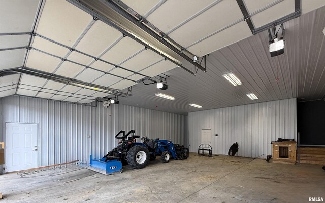 215 3rd St, Carmi, IL 62821 - garage featuring a garage door opener and metal wall