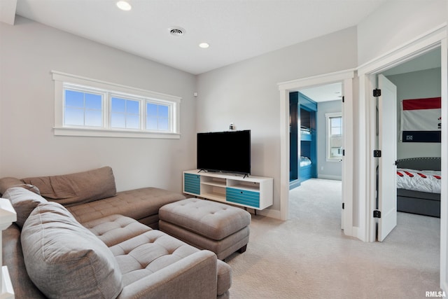 4691 Hidden Lake Ct, Bettendorf, IA 52722 - living room with light carpet, healthy amount of natural light, recessed lighting, and baseboards