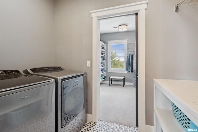 4691 Hidden Lake Ct, Bettendorf, IA 52722 - laundry room featuring washer and dryer, light carpet, and baseboards