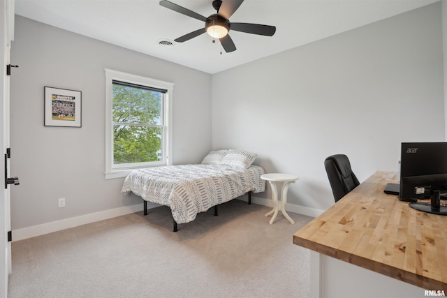 4691 Hidden Lake Ct, Bettendorf, IA 52722 - carpeted bedroom with baseboards, an office area, and ceiling fan