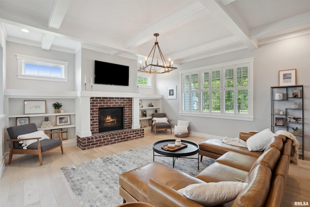 4691 Hidden Lake Ct, Bettendorf, IA 52722 - living room featuring beamed ceiling, a chandelier, wood finished floors, a brick fireplace, and baseboards