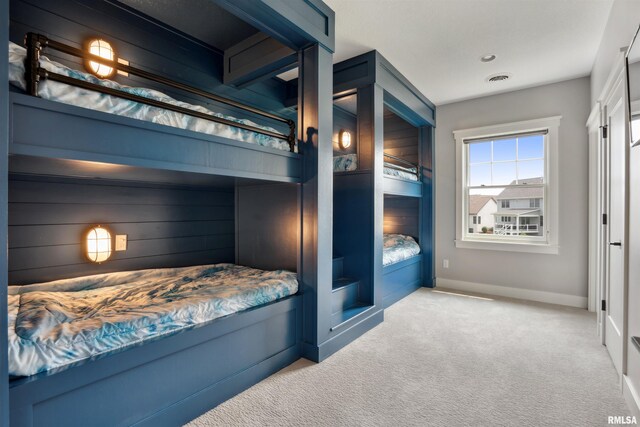4691 Hidden Lake Ct, Bettendorf, IA 52722 - carpeted bedroom featuring baseboards