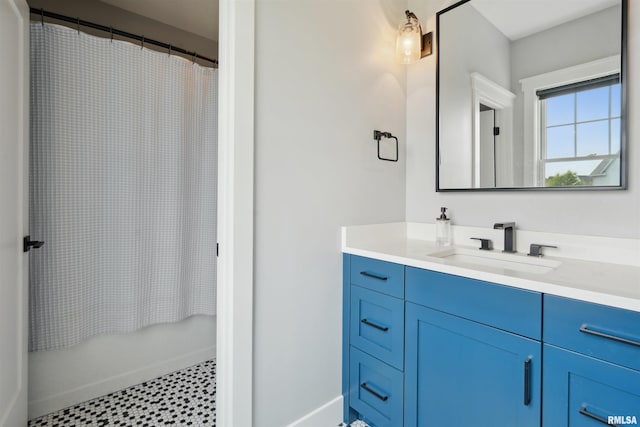 4691 Hidden Lake Ct, Bettendorf, IA 52722 - bathroom with vanity, curtained shower, tile patterned floors, and baseboards