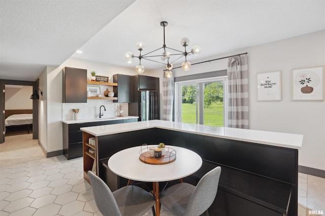 4691 Hidden Lake Ct, Bettendorf, IA 52722 - dining room with baseboards and a chandelier