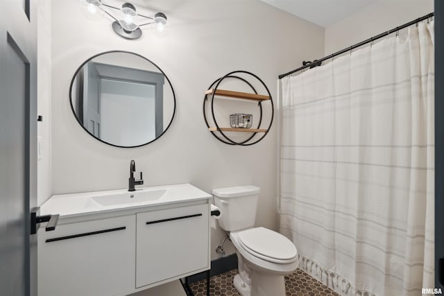 4691 Hidden Lake Ct, Bettendorf, IA 52722 - full bath featuring vanity, toilet, tile patterned floors, and curtained shower