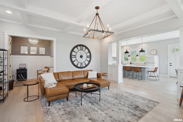 4691 Hidden Lake Ct, Bettendorf, IA 52722 - living area with a chandelier, light wood-style floors, beam ceiling, coffered ceiling, and recessed lighting