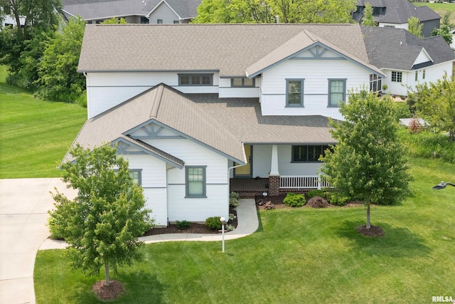4691 Hidden Lake Ct, Bettendorf, IA 52722 - view of front of property with covered porch, a front lawn, and a shingled roof