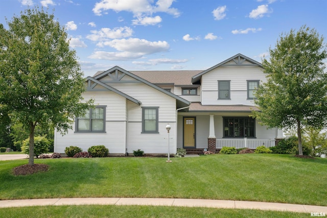 4691 Hidden Lake Ct, Bettendorf, IA 52722 - craftsman-style home with a porch, a front yard, and roof with shingles