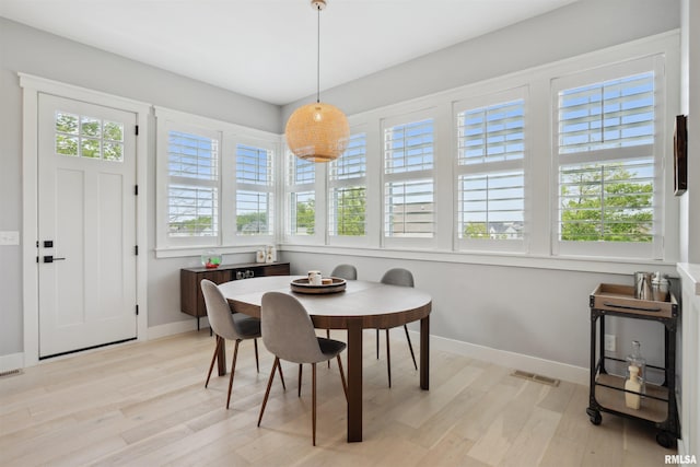 4691 Hidden Lake Ct, Bettendorf, IA 52722 - dining space featuring light wood-style floors and baseboards