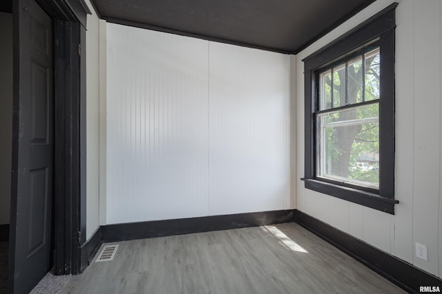 1522 Bridge Ave, Davenport, IA 52803 - empty room with wood finished floors and baseboards