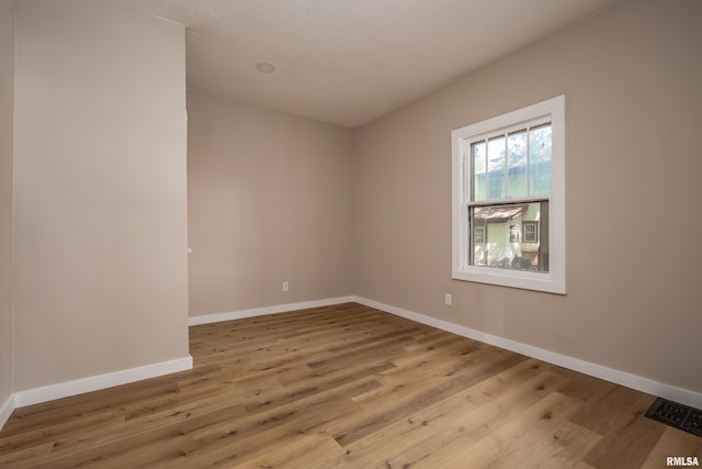 1522 Bridge Ave, Davenport, IA 52803 - unfurnished room with wood finished floors and baseboards