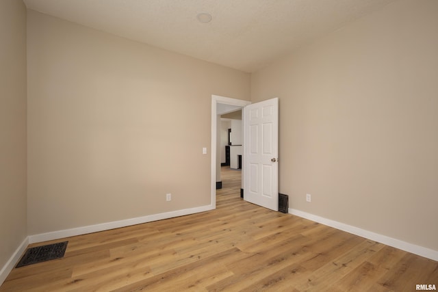 1522 Bridge Ave, Davenport, IA 52803 - unfurnished room with baseboards and light wood finished floors