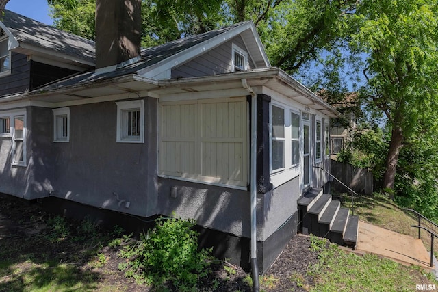 1522 Bridge Ave, Davenport, IA 52803 - view of side of home featuring a chimney and entry steps