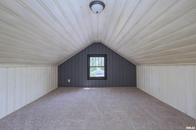 1522 Bridge Ave, Davenport, IA 52803 - additional living space with carpet flooring, vaulted ceiling, and wood walls
