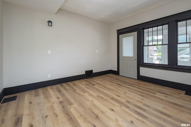 1522 Bridge Ave, Davenport, IA 52803 - spare room featuring baseboards and wood finished floors