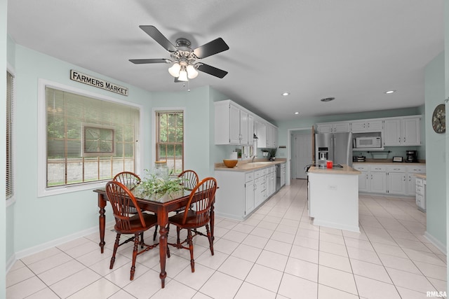 3513 33rd Street Ct, Moline, IL 61265 - dining space with ceiling fan, baseboards, recessed lighting, and light tile patterned floors