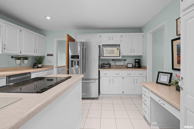 3513 33rd Street Ct, Moline, IL 61265 - kitchen featuring stainless steel appliances, white cabinets, light countertops, light tile patterned floors, and recessed lighting