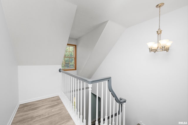 3513 33rd Street Ct, Moline, IL 61265 - stairs featuring a chandelier, wood finished floors, and baseboards