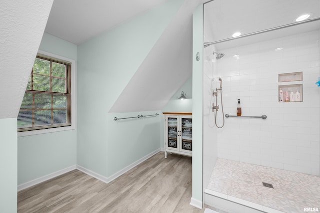 3513 33rd Street Ct, Moline, IL 61265 - bathroom featuring a tile shower, wood finished floors, baseboards, and recessed lighting