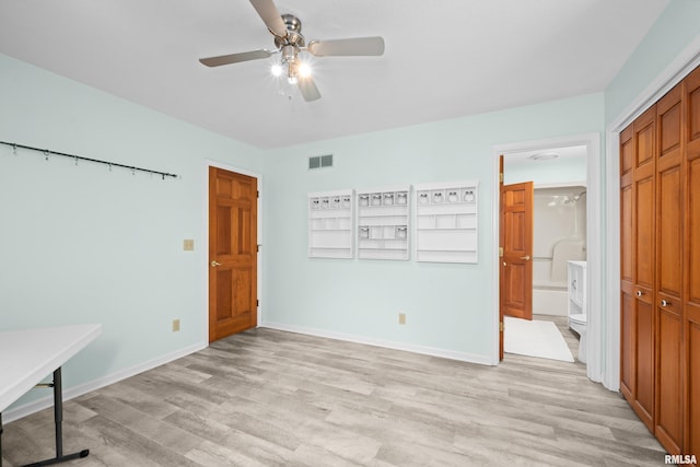 3513 33rd Street Ct, Moline, IL 61265 - unfurnished bedroom featuring light wood-type flooring, a closet, connected bathroom, a ceiling fan, and baseboards