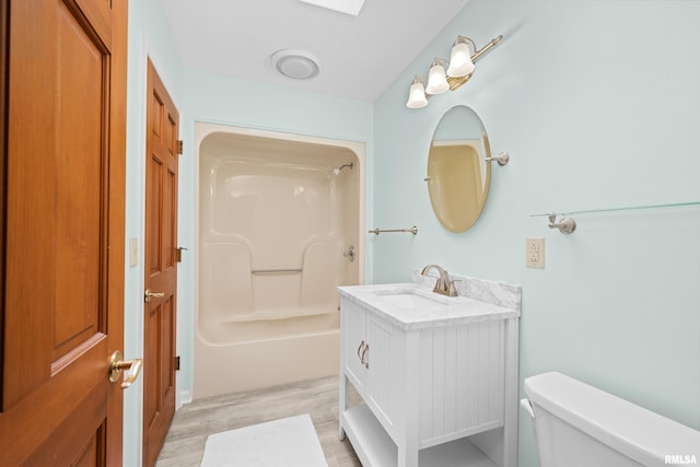 3513 33rd Street Ct, Moline, IL 61265 - full bathroom with toilet, vanity, shower / washtub combination, and wood finished floors