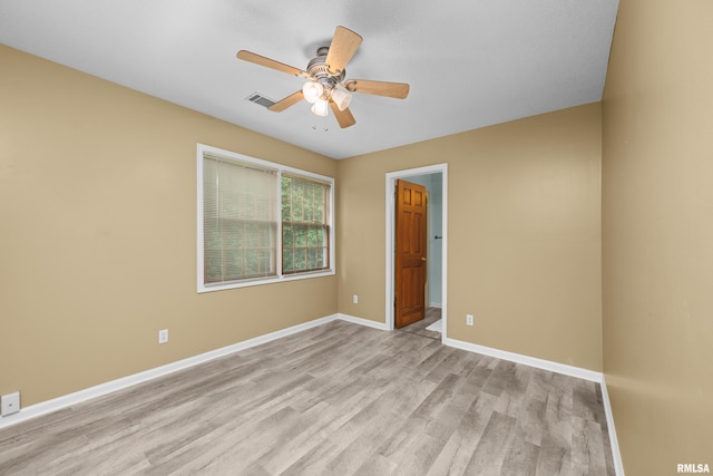 3513 33rd Street Ct, Moline, IL 61265 - empty room with light wood finished floors, ceiling fan, and baseboards
