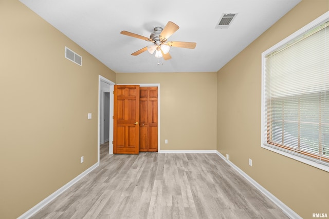 3513 33rd Street Ct, Moline, IL 61265 - unfurnished bedroom featuring light wood-type flooring, baseboards, and a ceiling fan
